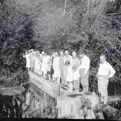 Camp Adams Picnic Group Standing on Nate Creek Dam.