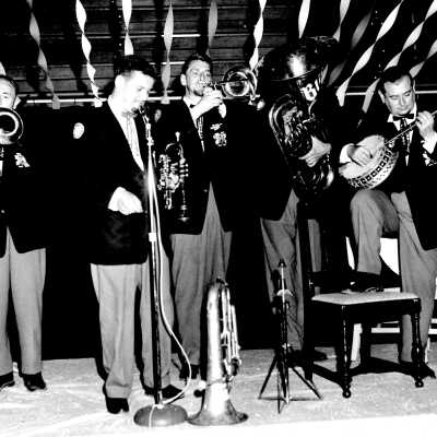 Band with Instruments - 5 men on a stage.