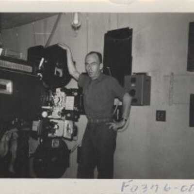 Unknown Man Standing by Projection Machine Fort Lewis Theatre #8 - 1942