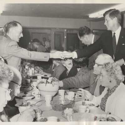 JFK Shaking Hand of Local Resident
