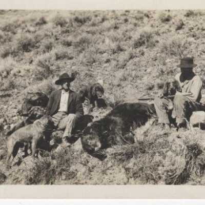 Unknown Men - Hunters - Dog and Bear