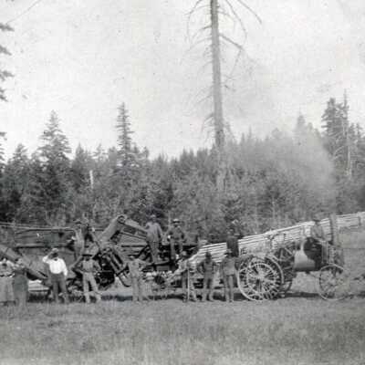 People in Front of Threshing Machine.