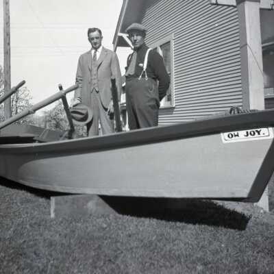 William Krueger and H.C. Frisbie with Rowboat in Yard. Photo #3.