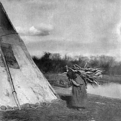 Native American Woman carrying wood "fuggots".