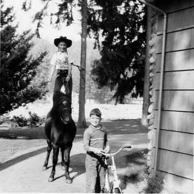 2856 - Girl standing on horse, boy on bike.tif
