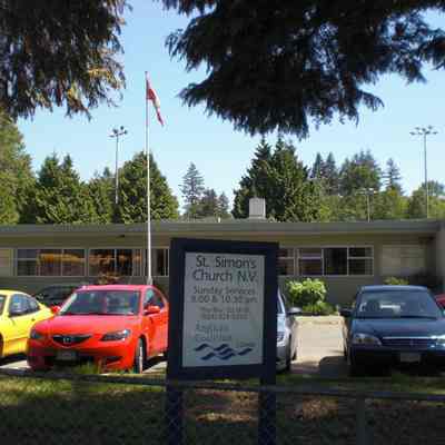 Lions Gate Christian Academy parking lot with sign St Simon's Church N.V. - 2