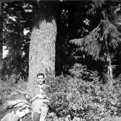 3768 - Don McGee resting against tree.tif