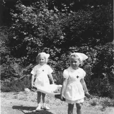 3528 - May Day Parade Nurses Eileen Alway, Anne Wells 1951 age 4.tif