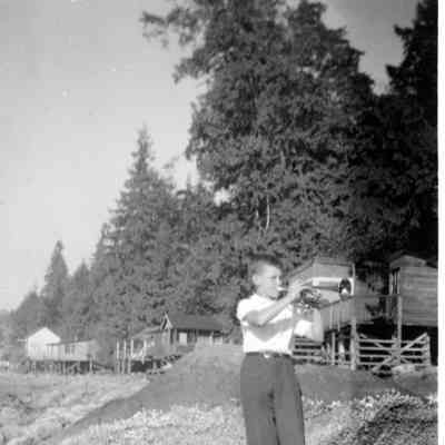 3693 - Boy on beach with trumpet 1947-52.tif