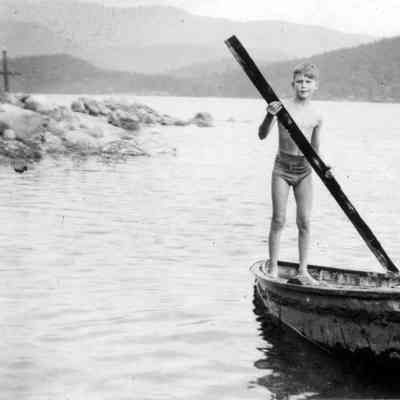 3694 - Boy paddling rowboat.tif