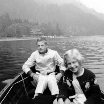 Kids in boat with Wigwam Inn in background