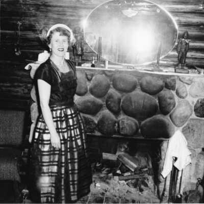 Deep Cove Motel, Reta Thornley by fireplace