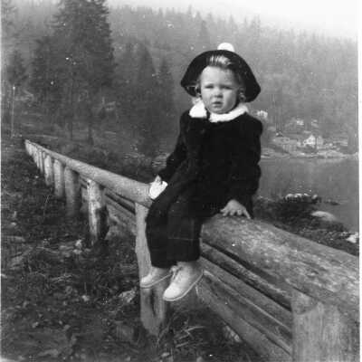 Deep Cove Sandra Crane 19 months, on park fence