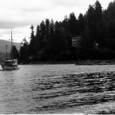 Deep Cove, sailboat, large house at the foot of Parkside Lane