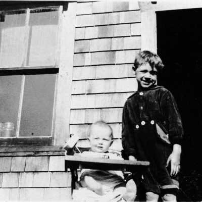 Gillis, Margaret with ? Patterson on porch