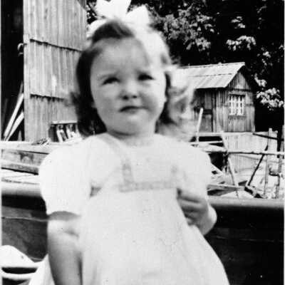 Child outside squatters' shacks, Cates Park