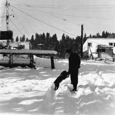 Mr. Rawlings and dog 'Lassie' in snow