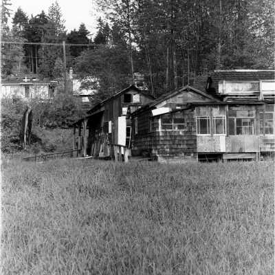 Maplewood Mudflats, corner view of shack with different levels and additions
