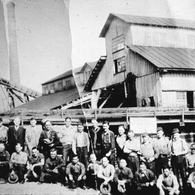 Dollar Mill Staff with buildings in back