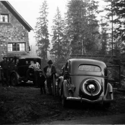 Moore & others in front of 2nd house