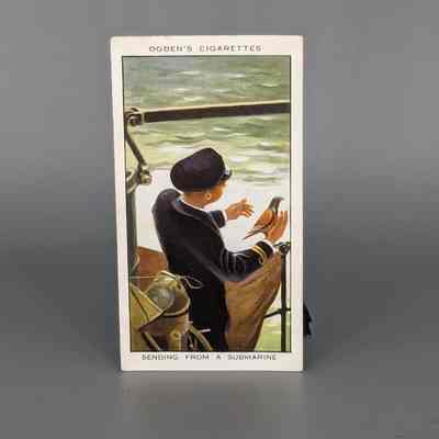 Ogden Cigarette cards: Sending a pigeon from a submarine