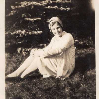 Woman Sitting by Tree