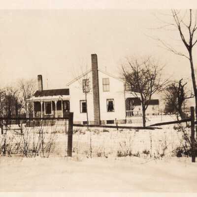 Snowy Yard with House
