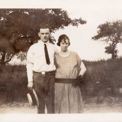 Couple Standing By Field