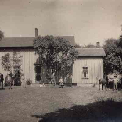 House With People In Front