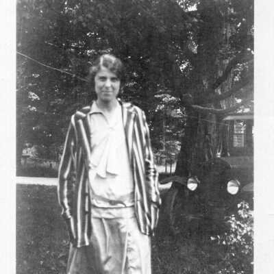Woman Standing by Automobile