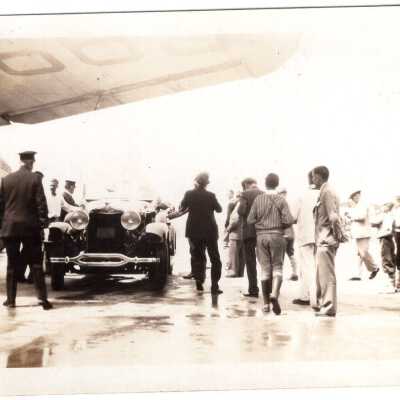 Automobile Under Plane Wing