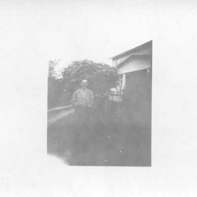 Portrait in Front of House