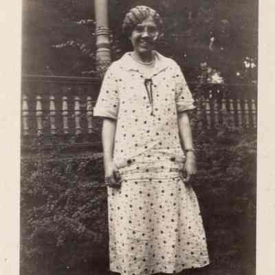 Elsie Milne Standing In Front Of Porch