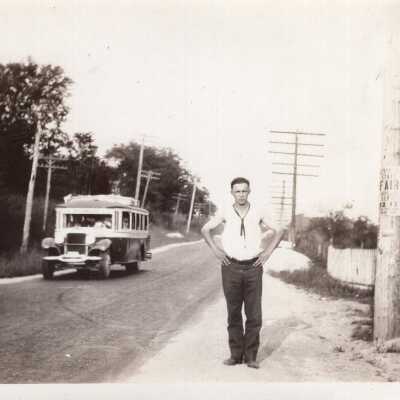 Man Standing on Sidewalk