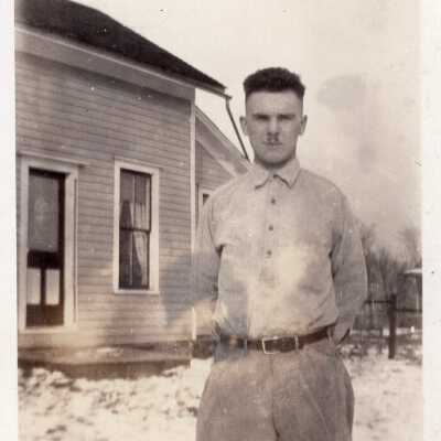 Portrait of Man in Front of House