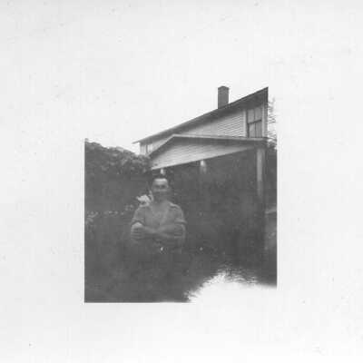 Portrait in Front of House