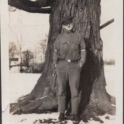 Man Standing By Tree