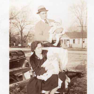 Couple Holding Babies