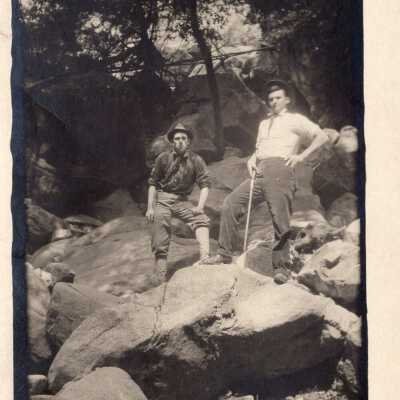 Two Men Standing in Rocky Landscape