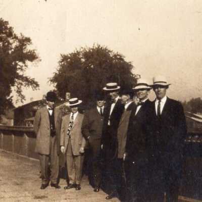 Group of Men on Bridge