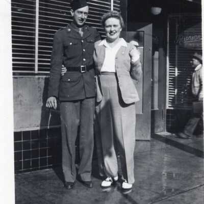 WWII Photo Of Soldier And Woman Standing In Front Of Tap Room
