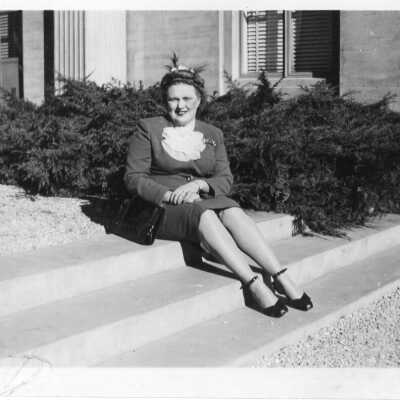 WWII Photo of woman sitting on a stoop