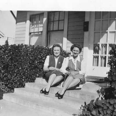 WWII Photo of two women sitting on a stoop