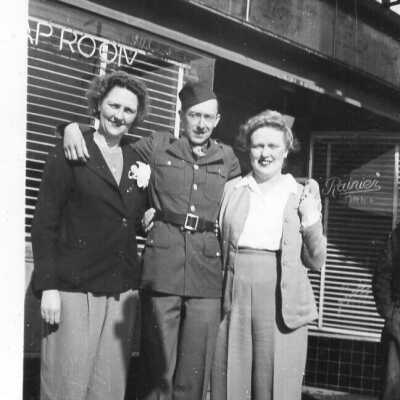 WWII Photo Of Soldier Standing In Front of Tap Room With Two Women
