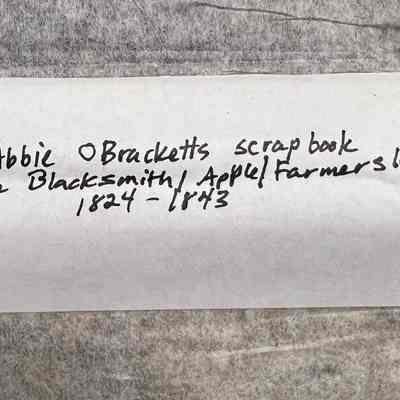 Miss Abbie O Bracketts scrapbook over a Blacksmith/Apple?farmer Ledger 1824-1843