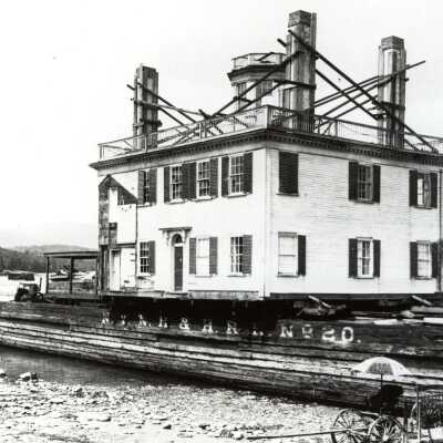 Spite House being moved by barge
