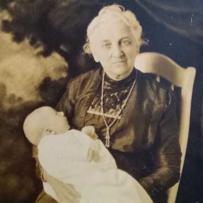 Woman in a Rocking Chair Holding a Baby