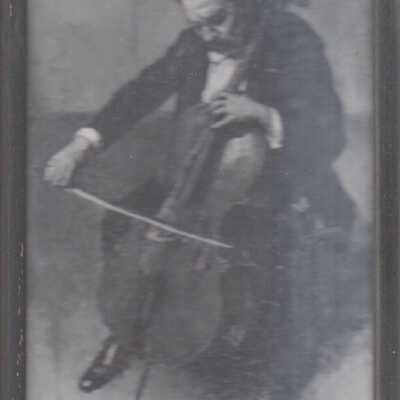 Framed photo of man playing cello