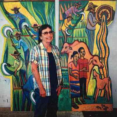 Photograph: Betty LaDuke with Rice Harvest
