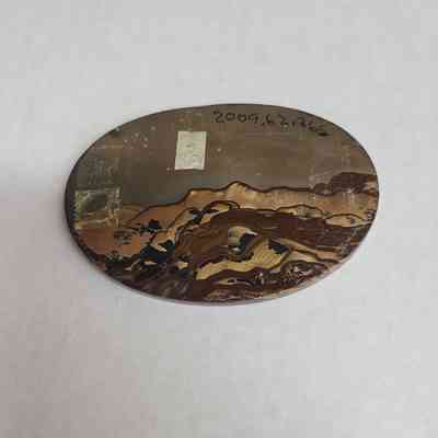 Reverse side: many residual sources of adhesive, one piece of masking tape with "2" written on it